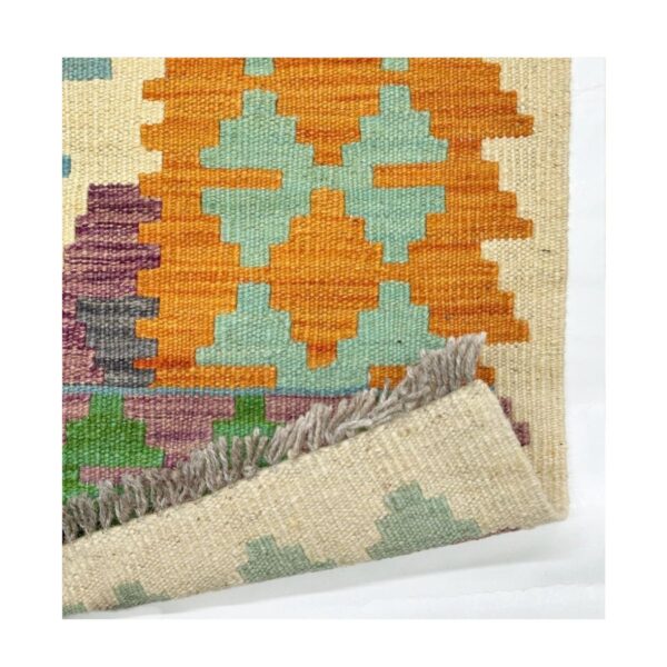 Tapete kilim tecido à mão com padrão geométrico em azul turquesa e laranja vívido.