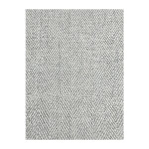 Detalhe de tecido herringbone neutro e sofisticado, ideal para moda e decoração de interiores.